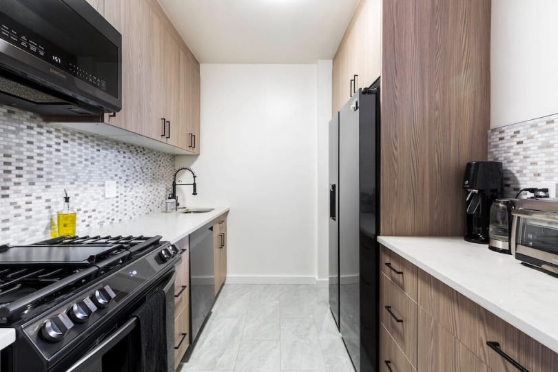 dark kitchen cabinets with white countertops